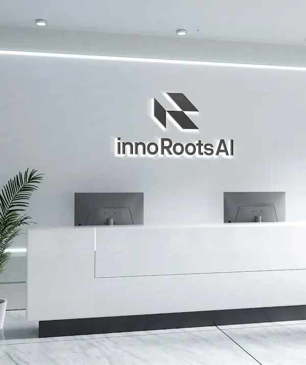 Reception at InnoRoots AI Pvt. Ltd., Mannarkkad — the innoRoots AI logo wall above the front desk.